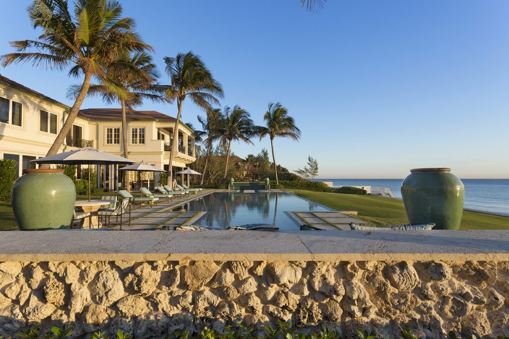 Luxury Real Estate Infinity Edge Pool Outdoor Living Space Resort Style Oceanfront Pascal Liguori and Son Broker Associates Premier Estate Properties Palm Trees Mansion