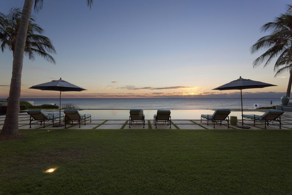 Luxury Real Estate Infinity Edge Pool Outdoor Living Space Resort Style Oceanfront Pascal Liguori and Son Broker Associates Premier Estate Properties Palm Trees Mansion
